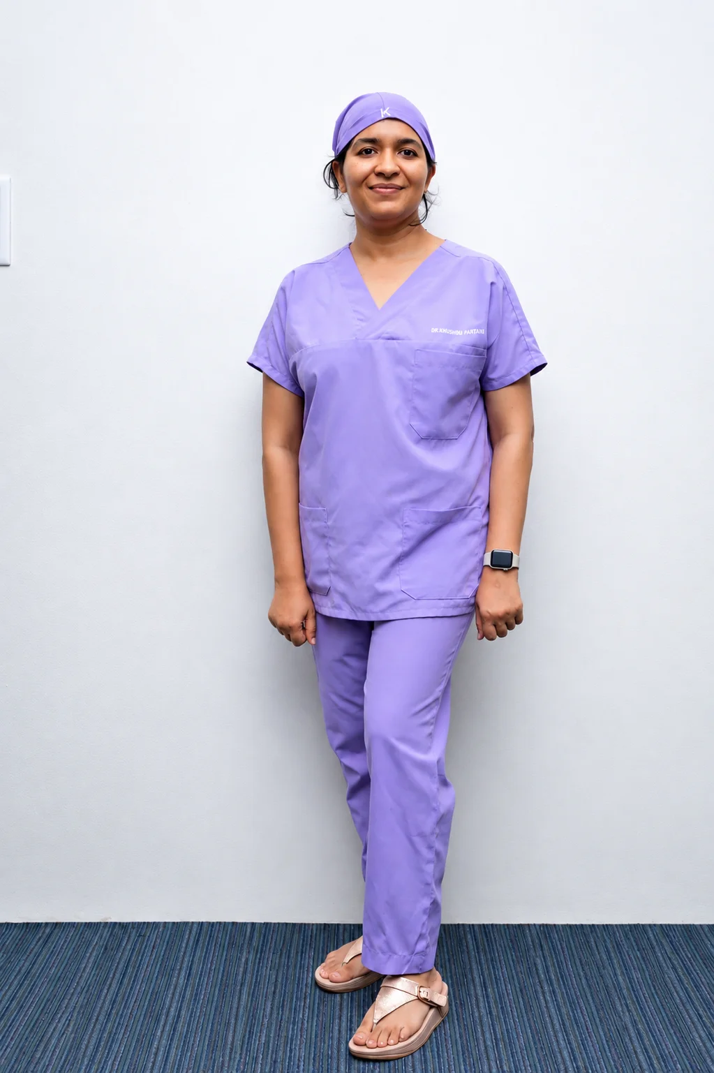 Dr. Khushbu in surgical scrubs